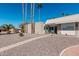 Cute mid-century home with desert landscaping and walkway at 5518 E Lindstrom Ln # A12, Mesa, AZ 85215