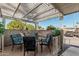 Covered patio with comfortable seating, creating a relaxing outdoor space at 5518 E Lindstrom Ln # A12, Mesa, AZ 85215