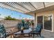 Private patio with covered pergola and outdoor seating at 5518 E Lindstrom Ln # A12, Mesa, AZ 85215