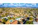 Aerial view showing a neighborhood with houses and pools at 6030 E Crocus Dr, Scottsdale, AZ 85254