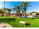 Large backyard with pool, artificial turf, and games at 6030 E Crocus Dr, Scottsdale, AZ 85254