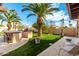 Landscaped backyard with artificial turf and patio furniture at 6030 E Crocus Dr, Scottsdale, AZ 85254