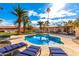 Inviting backyard with a sparkling pool, patio, and lush landscaping at 6030 E Crocus Dr, Scottsdale, AZ 85254