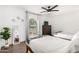 Guest bedroom with two twin beds and ceiling fan at 6030 E Crocus Dr, Scottsdale, AZ 85254