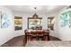 Bright dining area with a table for four, overlooking the pool area at 6030 E Crocus Dr, Scottsdale, AZ 85254