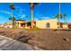 House exterior with desert landscaping and a large front yard at 6030 E Crocus Dr, Scottsdale, AZ 85254