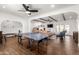 Open living space with ping pong table, sectional sofa, and wood beam ceiling at 6030 E Crocus Dr, Scottsdale, AZ 85254