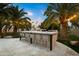 Outdoor kitchen with bar seating and fire feature at 6030 E Crocus Dr, Scottsdale, AZ 85254