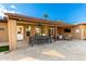 Covered patio with dining table and comfortable seating at 6030 E Crocus Dr, Scottsdale, AZ 85254