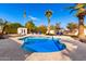 Freeform pool with spacious deck and lounge chairs at 6030 E Crocus Dr, Scottsdale, AZ 85254