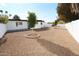 Backyard with gravel and two small trees at 634 E Calavar Rd, Phoenix, AZ 85022