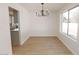 Bright dining room with chandelier and hardwood floors at 634 E Calavar Rd, Phoenix, AZ 85022