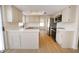 Kitchen with light cabinets, white countertops, and stainless steel appliances at 634 E Calavar Rd, Phoenix, AZ 85022