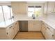 Updated kitchen featuring white cabinets and a new sink at 634 E Calavar Rd, Phoenix, AZ 85022