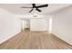 Spacious living room with light flooring and ceiling fan at 634 E Calavar Rd, Phoenix, AZ 85022