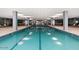 Resort-style indoor swimming pool with lounge chairs at 7137 E Rancho Vista Dr # 6010, Scottsdale, AZ 85251