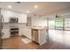 Modern kitchen with white shaker cabinets, stainless steel appliances, and hardwood floors at 7137 E Rancho Vista Dr # 6010, Scottsdale, AZ 85251