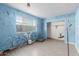 Bedroom with laminate floors and a large window at 7501 E Pierce St, Scottsdale, AZ 85257