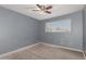 Bright bedroom with wood-look floors and a window with blinds at 7501 E Pierce St, Scottsdale, AZ 85257