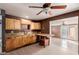 Kitchen with wood cabinets, granite counters, and an island at 7501 E Pierce St, Scottsdale, AZ 85257