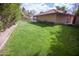 Large grassy backyard with mature trees at 7701 S Butte Ave, Tempe, AZ 85284