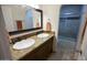 Double vanity bathroom with granite countertops at 7701 S Butte Ave, Tempe, AZ 85284