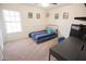 Comfortable bedroom featuring a desk and window at 7701 S Butte Ave, Tempe, AZ 85284