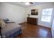 Bright bedroom with wood floors and ample light at 7701 S Butte Ave, Tempe, AZ 85284