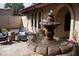 Close-up of a charming courtyard fountain with stone detailing at 7701 S Butte Ave, Tempe, AZ 85284