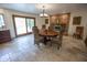 Bright dining room features a brick fireplace and sliding glass doors leading to the patio at 7701 S Butte Ave, Tempe, AZ 85284