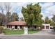 Single story home with red tile roof, landscaped lawn, and large tree at 7701 S Butte Ave, Tempe, AZ 85284