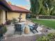 Relaxing front patio with seating, fountain, and landscaping at 7701 S Butte Ave, Tempe, AZ 85284