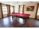 Game room boasts a pool table and hardwood floors at 7701 S Butte Ave, Tempe, AZ 85284