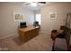 Home office with a large desk and comfortable chair at 7701 S Butte Ave, Tempe, AZ 85284