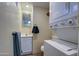 Bathroom with toilet, sink, and stackable washer/dryer at 7750 E Broadway Rd # 83, Mesa, AZ 85208