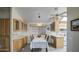 Kitchen and dining area with wood cabinets and table at 7750 E Broadway Rd # 83, Mesa, AZ 85208