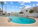 Community pool with plenty of lounge chairs for relaxation at 8578 E Indian School Rd # I, Scottsdale, AZ 85251