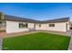 Modern home exterior with a grassy front yard and walkway at 8602 E Plaza Ave, Scottsdale, AZ 85250