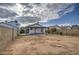 View of the home from the backyard, featuring a covered patio at 8728 W Vale Dr, Phoenix, AZ 85037