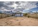 View of the home from the backyard, featuring a covered patio at 8728 W Vale Dr, Phoenix, AZ 85037