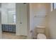 Bathroom with toilet, vanity, and tiled floor at 8728 W Vale Dr, Phoenix, AZ 85037