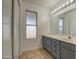 Bathroom with vanity, sink, and tiled floor at 8728 W Vale Dr, Phoenix, AZ 85037