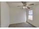 Bedroom with ceiling fan and carpet flooring at 8728 W Vale Dr, Phoenix, AZ 85037