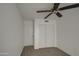 Bright bedroom with neutral walls, carpet flooring, and double door closet at 8728 W Vale Dr, Phoenix, AZ 85037