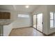 Kitchen dining area with access to backyard patio at 8728 W Vale Dr, Phoenix, AZ 85037