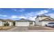 Front view of a white house with a two-car garage at 8728 W Vale Dr, Phoenix, AZ 85037