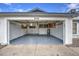 Clean and spacious garage with overhead storage cabinets at 8728 W Vale Dr, Phoenix, AZ 85037