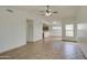 Bright living room featuring tile floors and a ceiling fan at 8728 W Vale Dr, Phoenix, AZ 85037