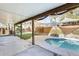 Relaxing covered patio view of the pool and landscape in the private backyard at 8818 W Virginia Ave, Phoenix, AZ 85037