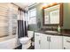 Elegant bathroom with modern vanity, new sink, and updated shower with decorative tile and fixtures at 8818 W Virginia Ave, Phoenix, AZ 85037